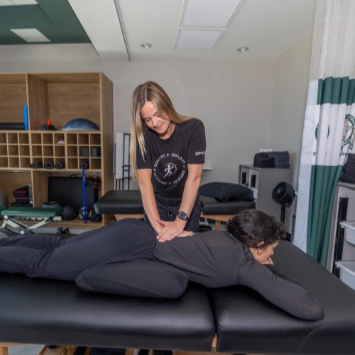 Dr. Jessica Jones helps patient with balance training